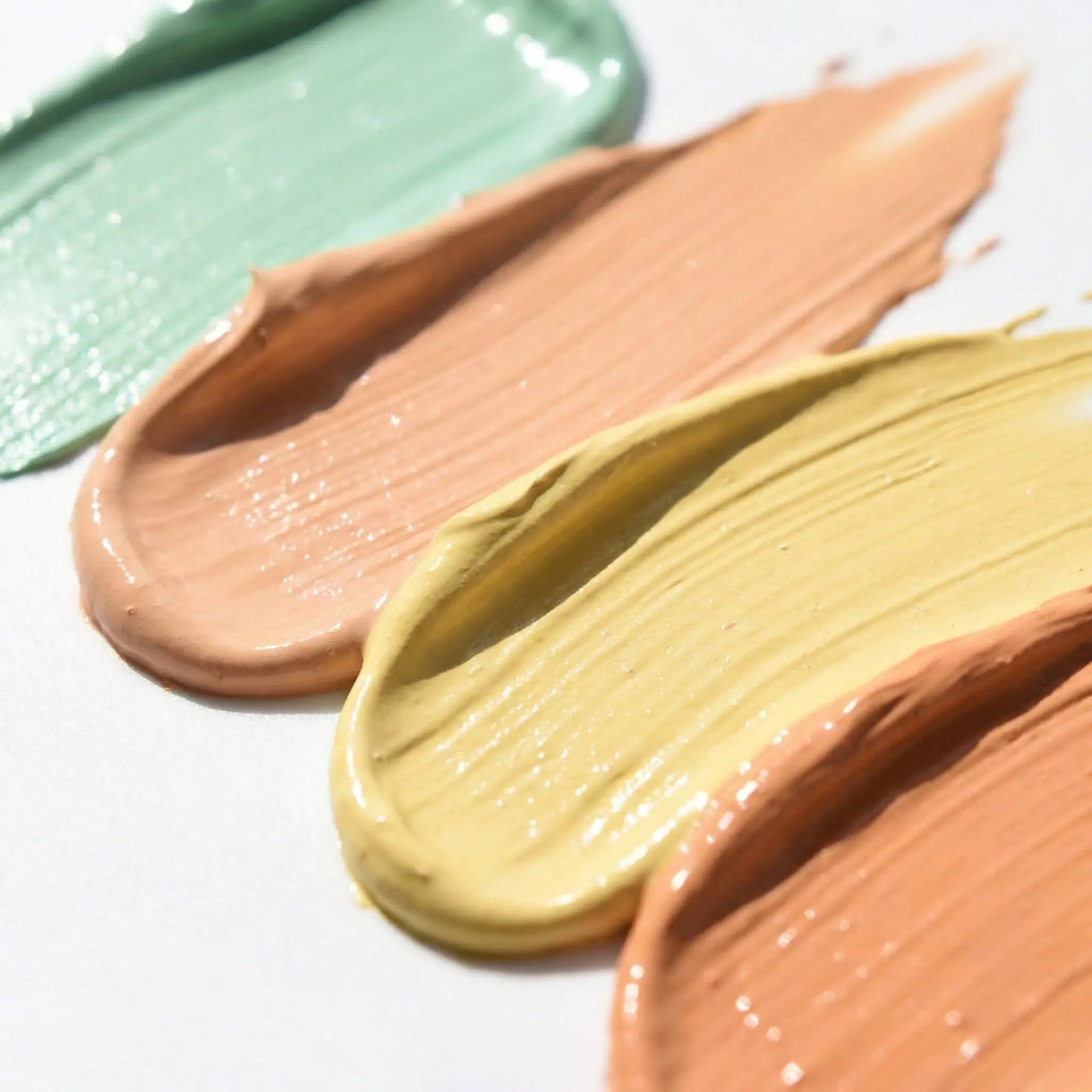 Color Correctors concealer swatches, 3 colors in green, peach and yellow by AmazingCosmetics