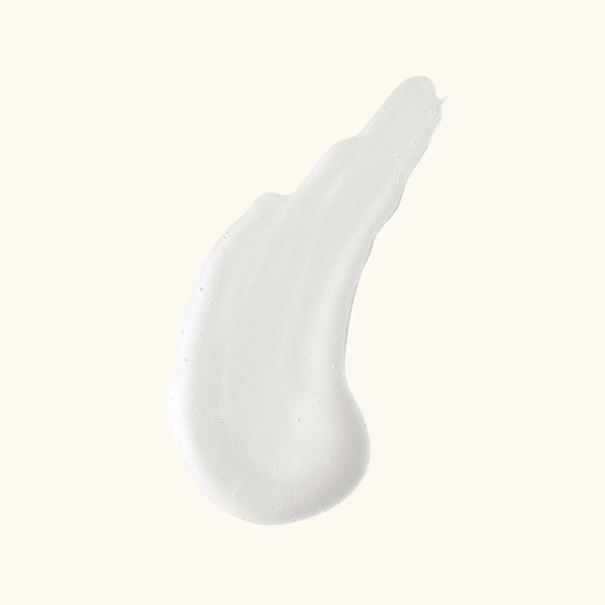 Clarifying Brightening Cleanser smear on beige background