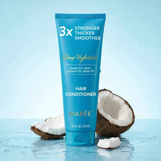 Deep Hydration Coconut Conditioner tube by Mareé in blue with coconut halves