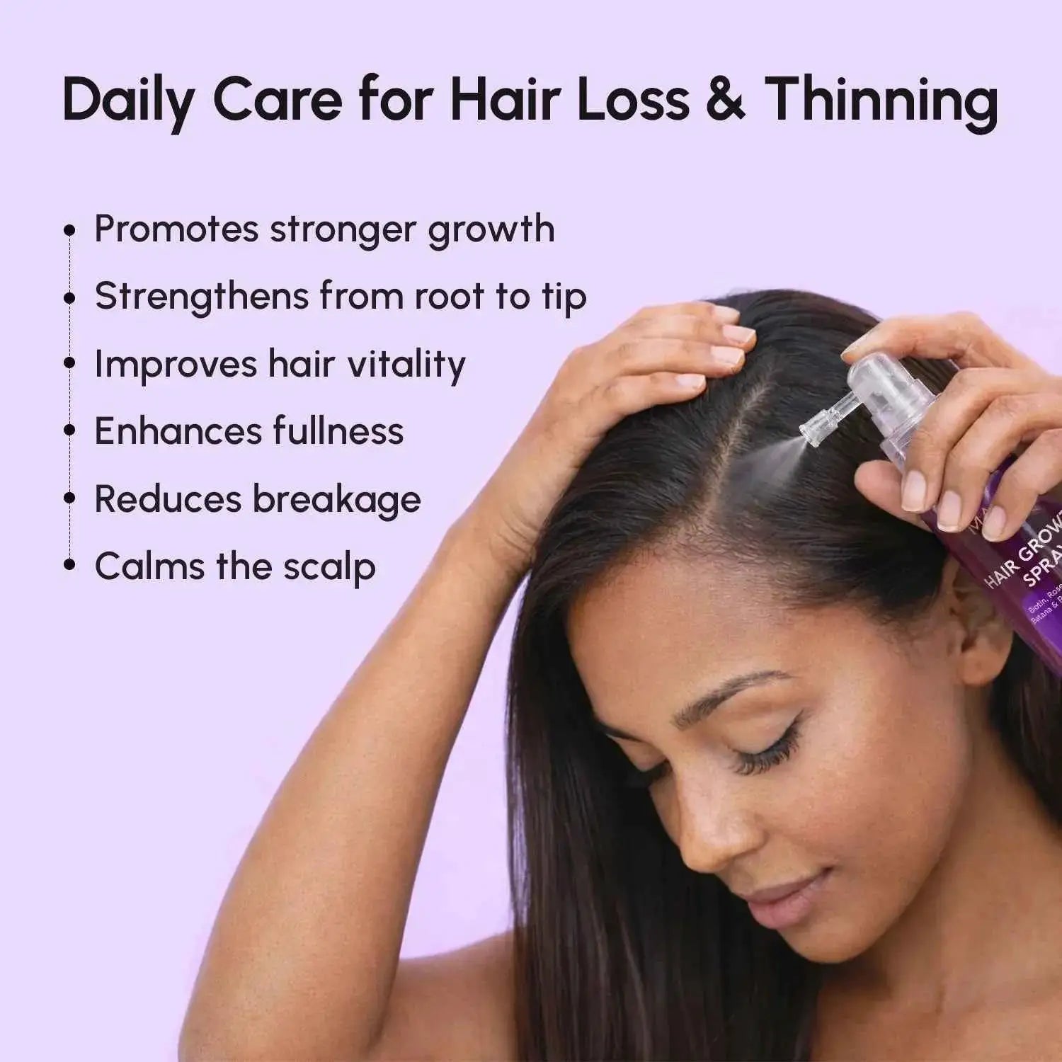 4-in-1 Hair Growth Spray bottle, purple, being applied to the scalp