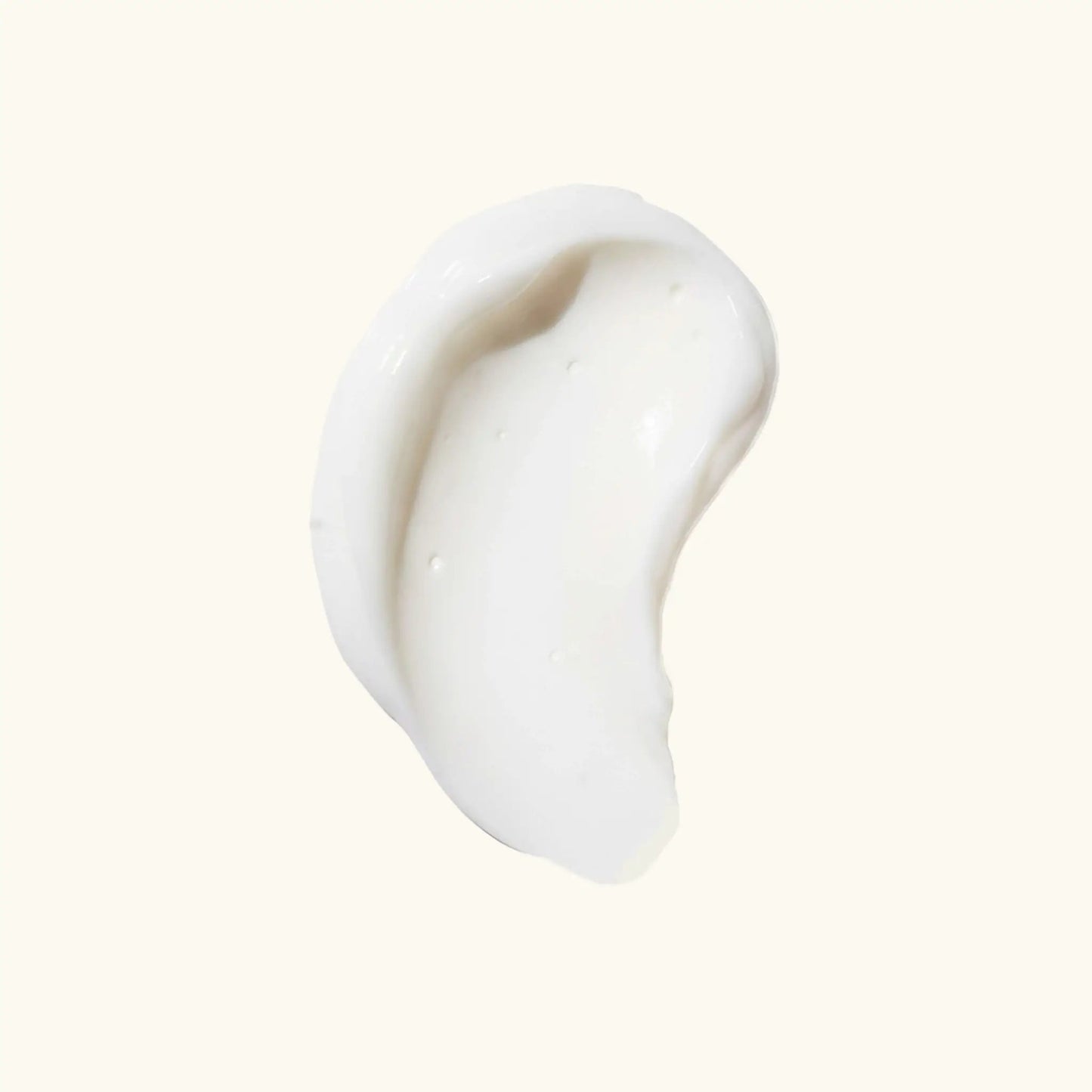 Illuminating Intimate Serum body oil; creamy white swirl on a pale background, high-detail texture