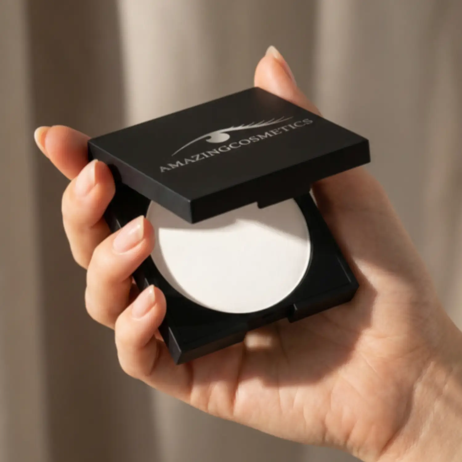 Velvet Mineral Powderset compact by AmazingCosmetics, black case with white powder.