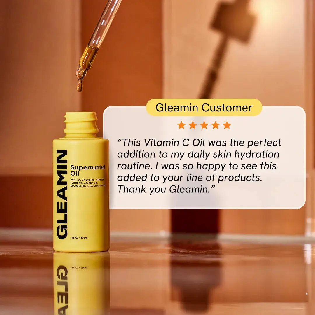 Gleamin Supernutrient Oil face oil bottle with dropper, yellow container