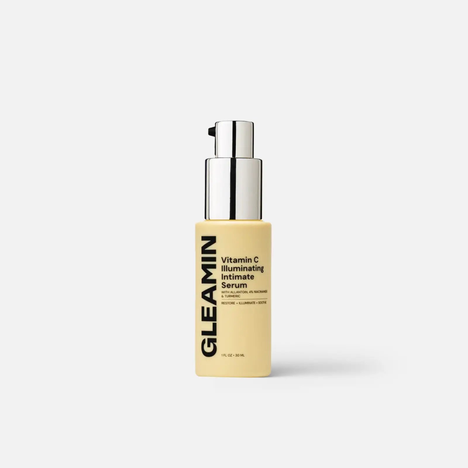 Gleamin Illuminating Intimate Serum body oil bottle with beige container and silver pump