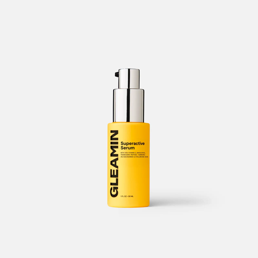 Gleamin Superactive Serum bottle with bright yellow label and silver pump.