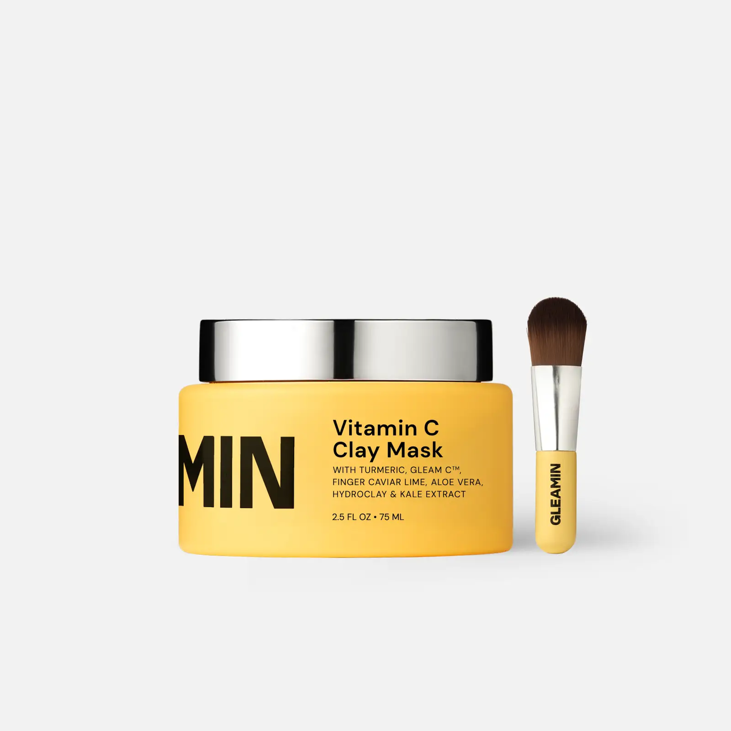 Vitamin C Clay Mask by Gleamin; yellow jar with black lid and matching brush